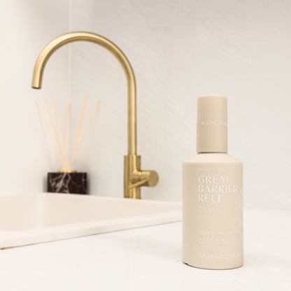 Maine Beach Great Barrier Reef home and linen mist with notes of lemon peel, spearmint and sea salt, on a bathroom vanity
