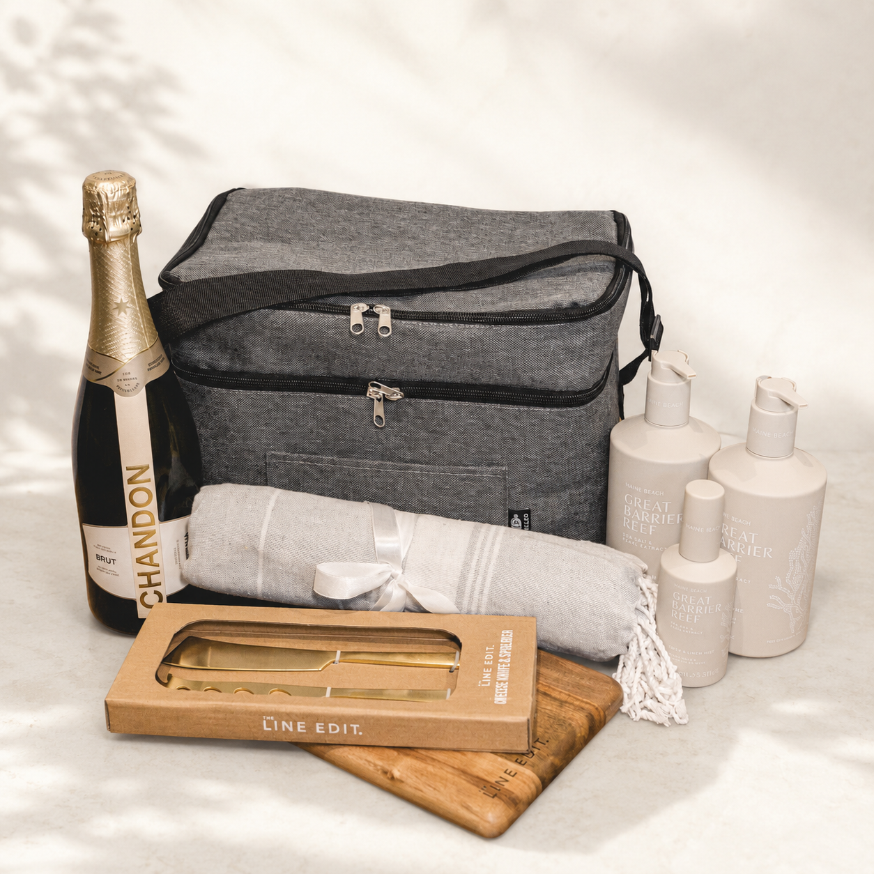 A Little Piece of Heaven luxury gift hamper – Chandon Brut, grey cooler bag, Maine Beach body wash, Turkish towel and cheese knife set