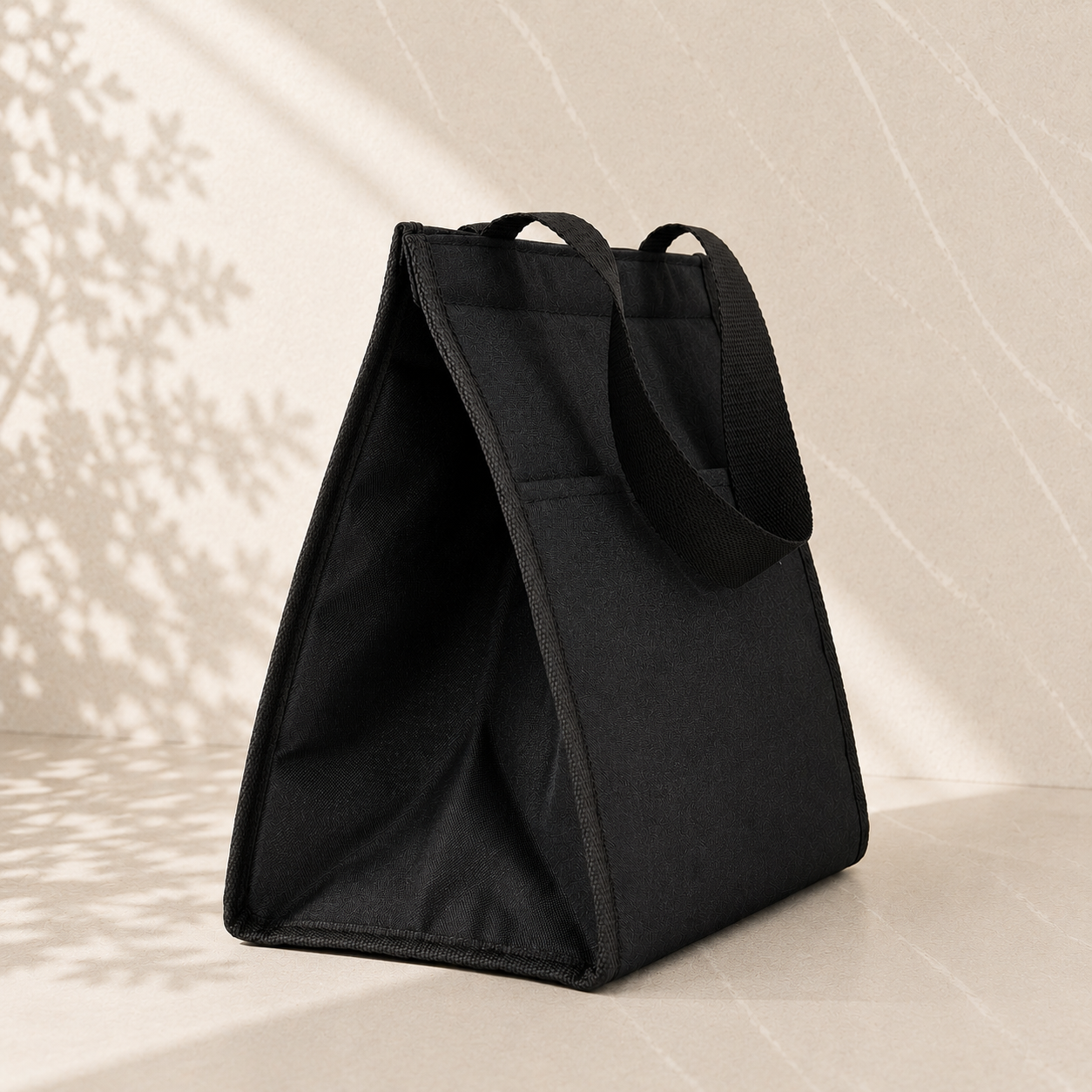 aPremium black insulated cooler bag – presentation packaging for A Little Hello sweet gift hamper by The Gifting Pantry