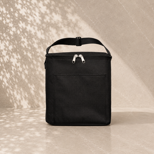 Black 8L insulated cooler bag with zip closure and front pocket, used to present gift hampers by The Gifting Pantry