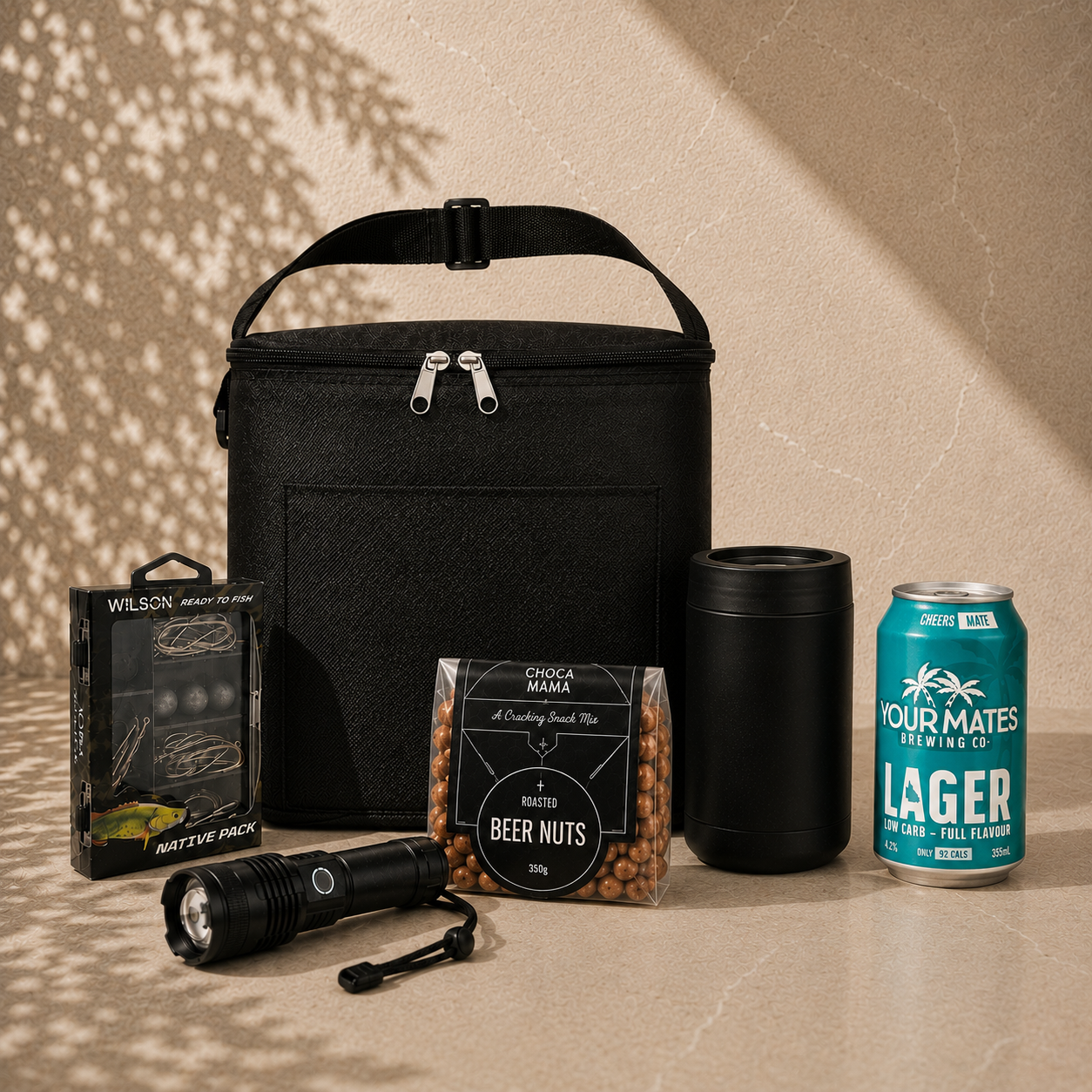 Cast Off fishing gift hamper with Your Mates Lager can, black insulated cooler bag, Wilson tackle kit, rechargeable torch, drink cooler and beer nuts