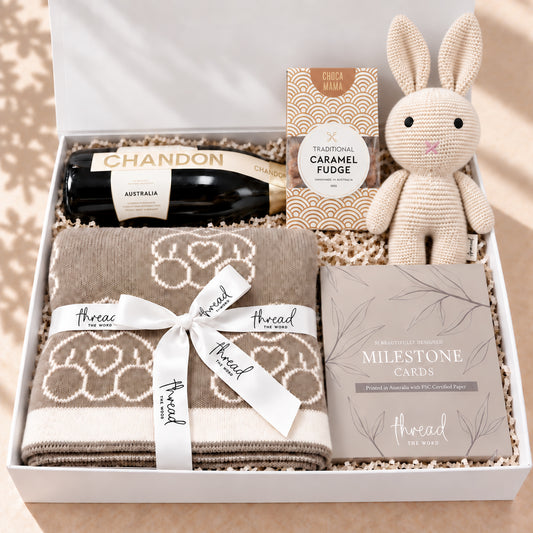 Cheers to the New Arrival baby gift hamper in Eggshell, teddy bear blanket, bunny, milestone cards and Chandon in a white gift box