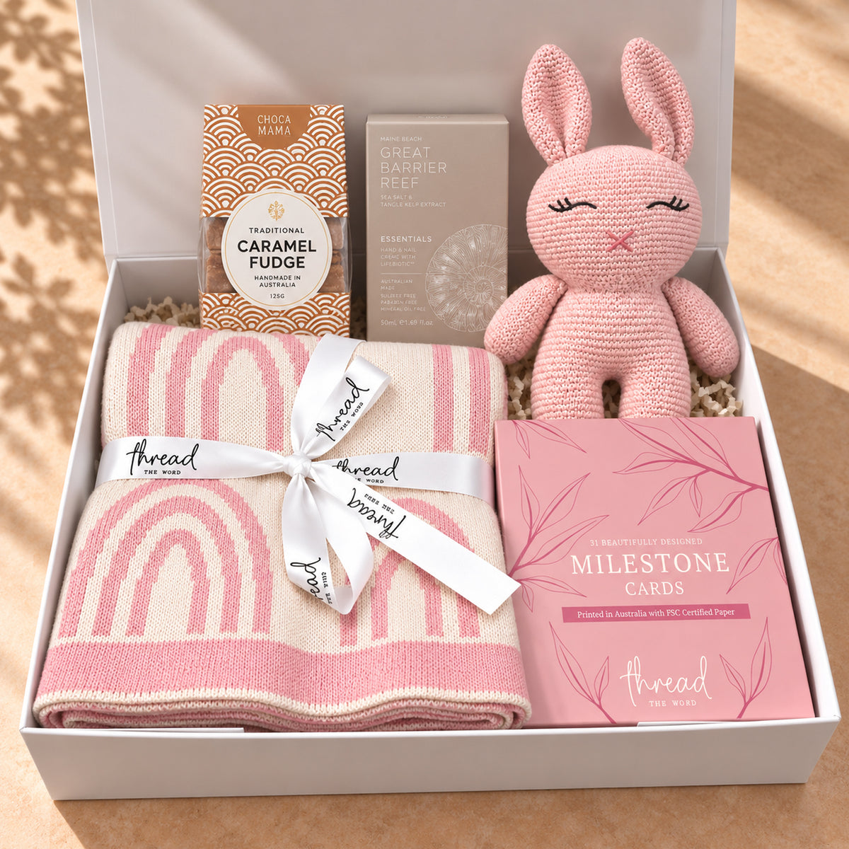 Hello Little One, and You gift hamper in Pink, rainbow print blanket, bunny and milestone cards packed in a white gift box