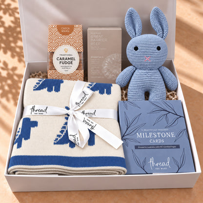 Hello Little One, and You gift hamper in Seamist, dinosaur print blanket, bunny and milestone cards packed in a white gift box