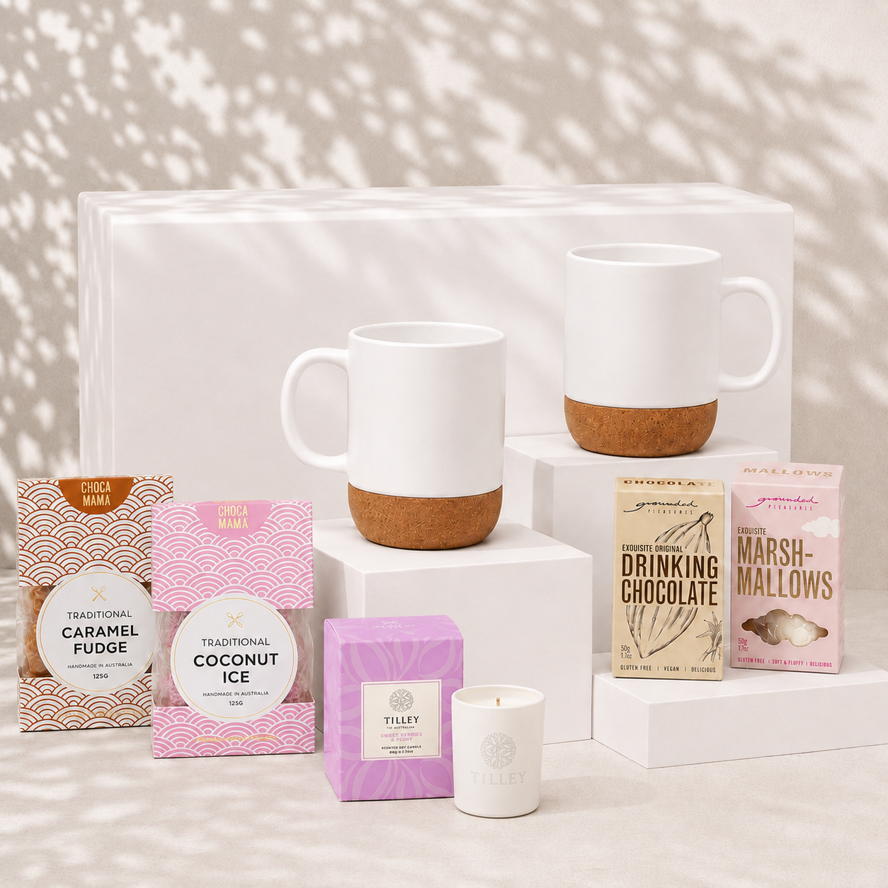 Made for Two couples gift hamper with two white ceramic cork-base mugs, soy candle, drinking chocolate, marshmallows, caramel fudge and coconut ice