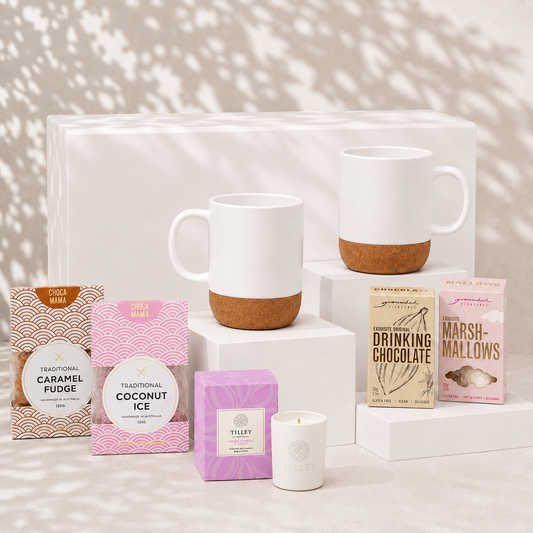 Made for Two couples gift hamper with two white ceramic cork-base mugs, soy candle, drinking chocolate, marshmallows, caramel fudge and coconut ice