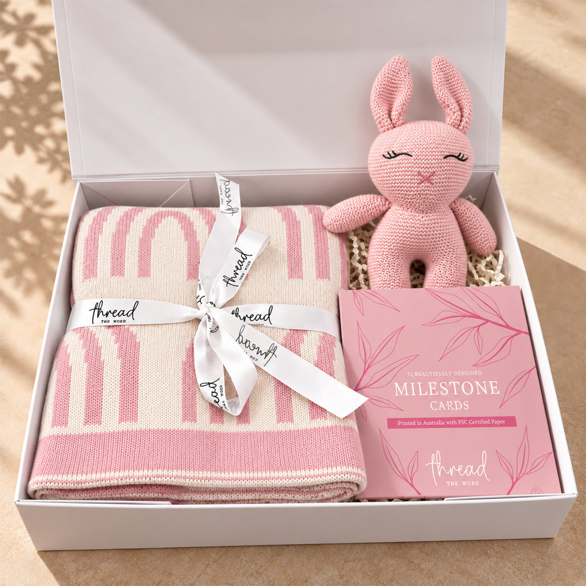 Hello Little One baby gift hamper in Pink, rainbow print cotton blanket, knitted bunny and milestone cards