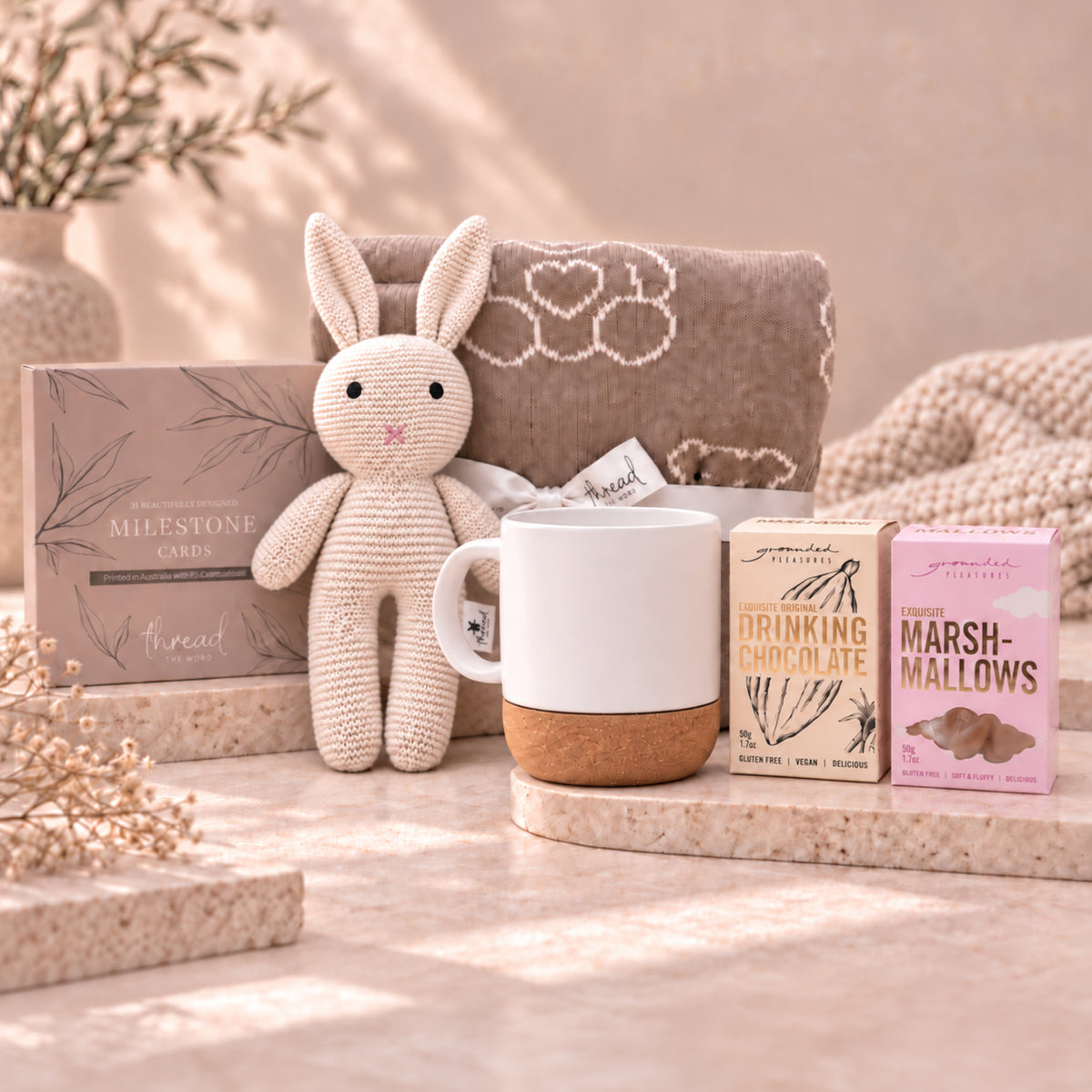 Eggshell new parent gift set, teddy bear blanket, cream bunny, ceramic mug, Grounded Pleasures drinking chocolate and marshmallows