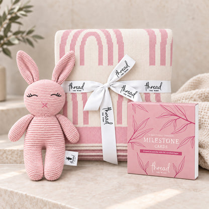 Pink baby gift set, rainbow print cotton blanket, pink knitted bunny and Thread the Word milestone cards