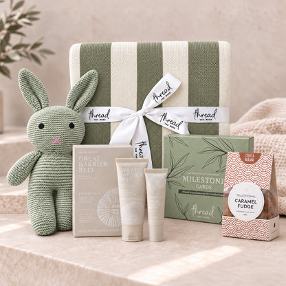Sage baby and new parent gift set, heritage stripe blanket, knitted bunny, Maine Beach skincare and caramel fudge