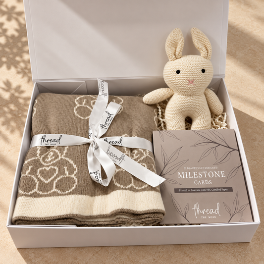 Hello Little One baby gift hamper in Eggshell, teddy bear print cotton blanket, knitted bunny and milestone cards